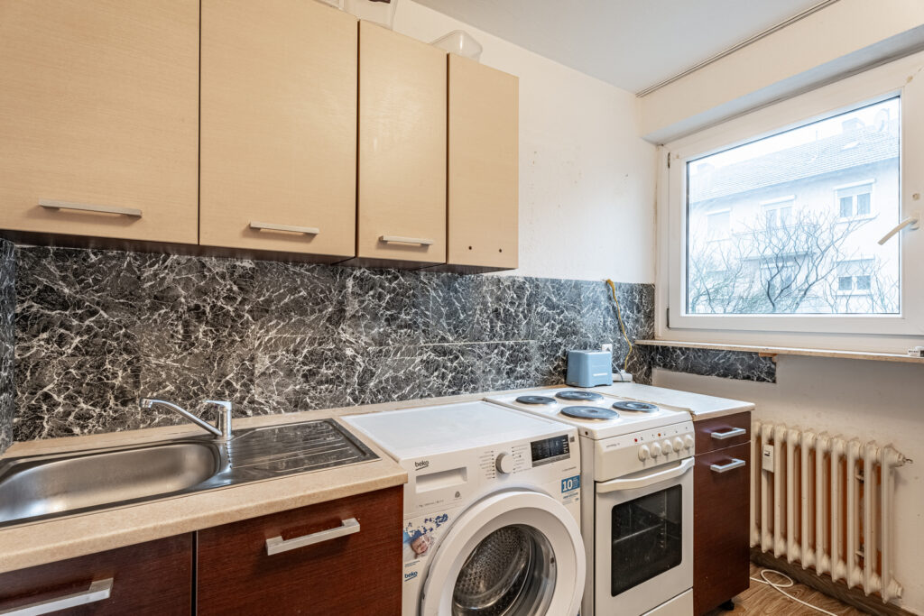 KB Immobilien - Inserat - Aluminiumstraße 12, 2 Zimmer - Küche Ansicht 1